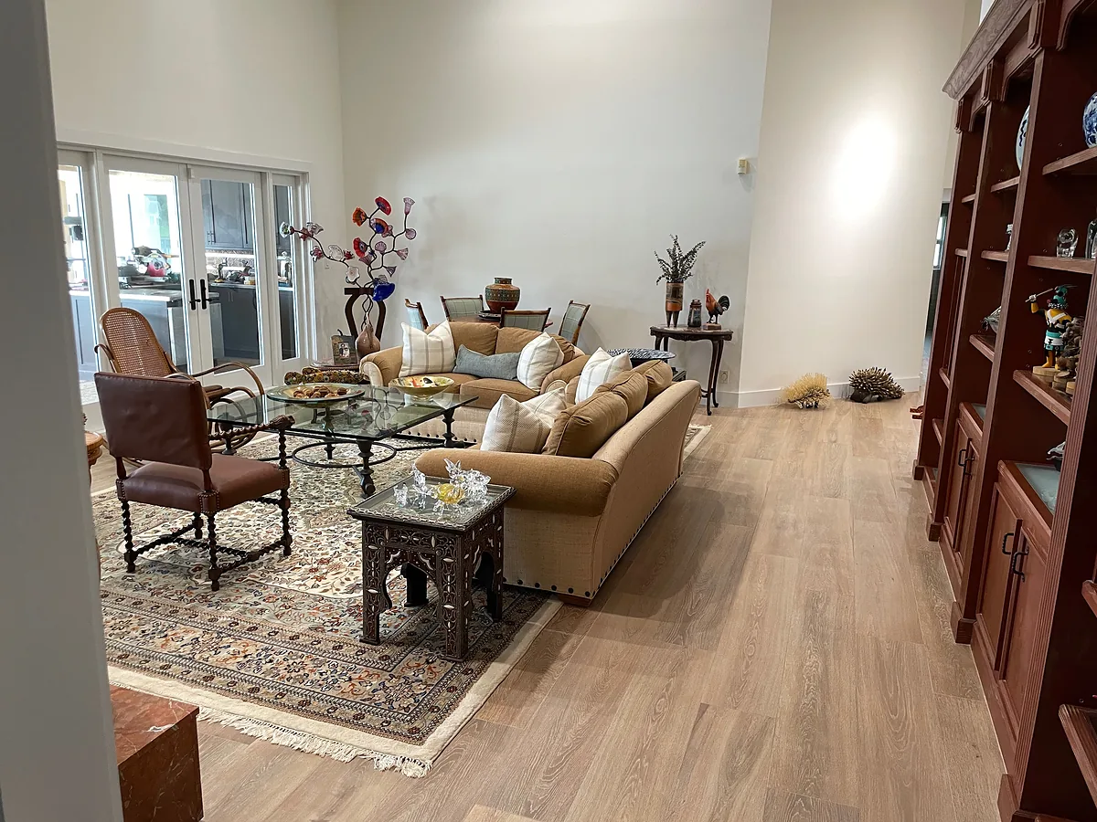Open-concept living room remodel with wide-plank flooring